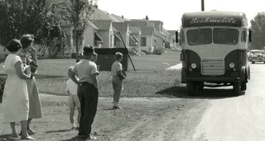 Impatiently waiting for the Saint Paul Public Library bookmobile, 1950s